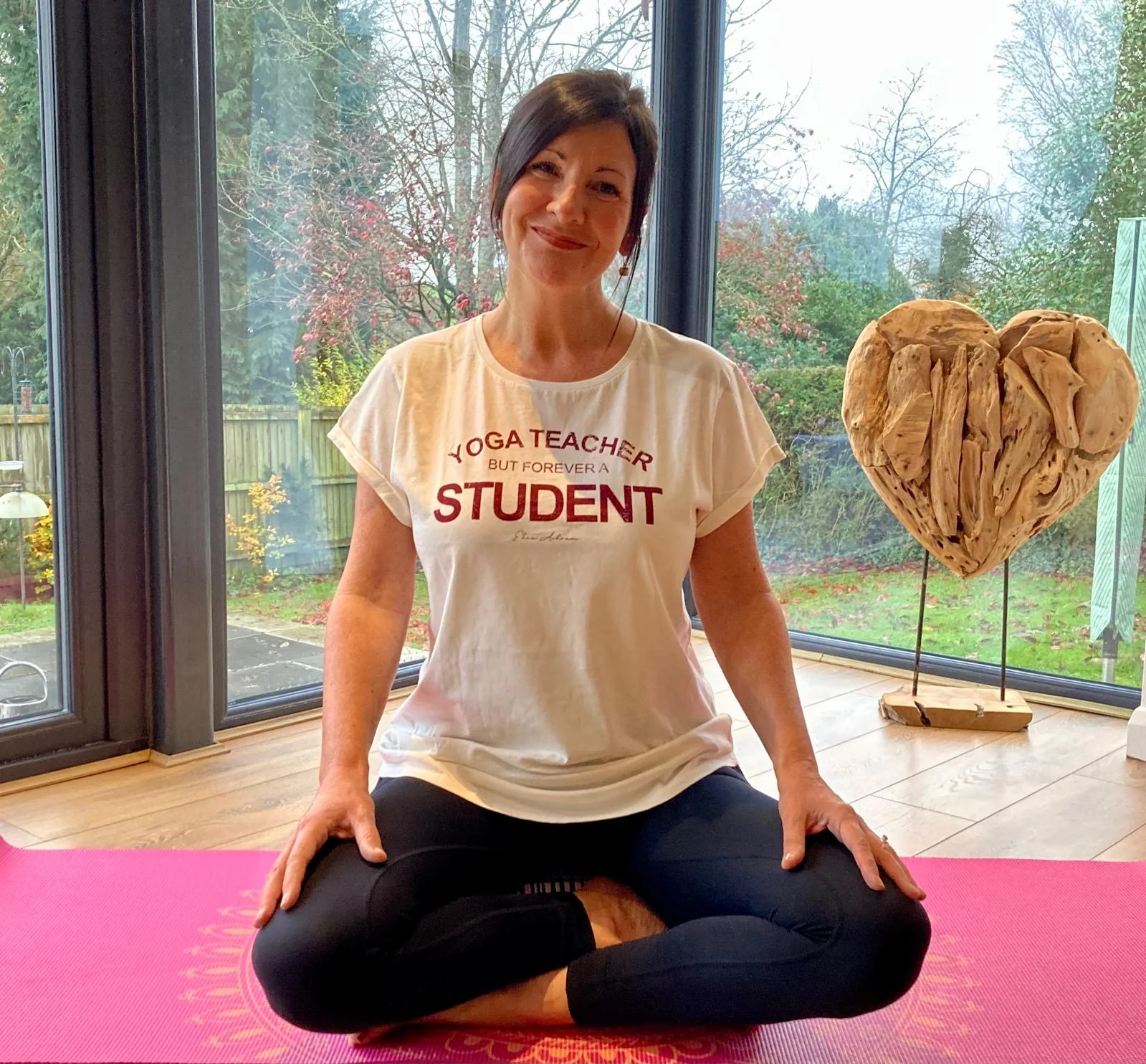 Amanda seated comfortably for a mindful yoga practice